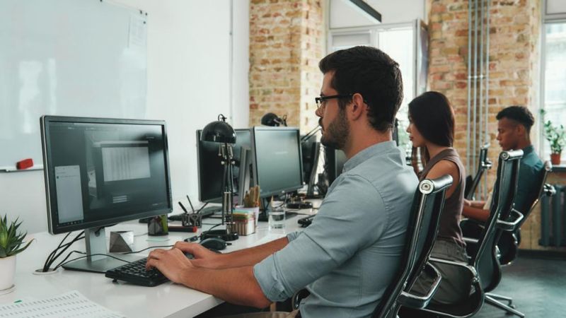 Australian cyber security professionals working together in an enterprise office